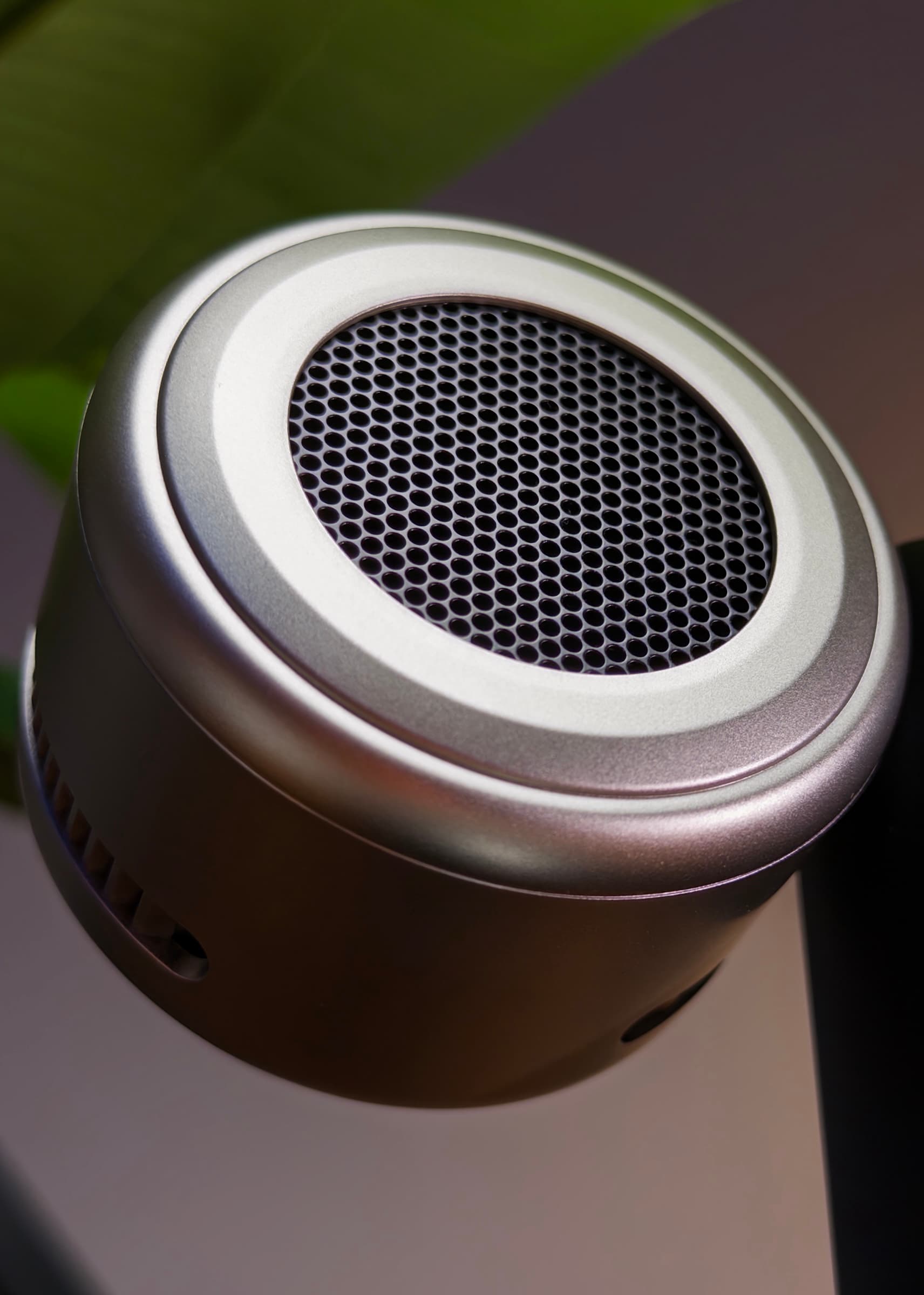 Back of the MagFlow Pro's round aluminium charging head, showing its perforated mesh grille