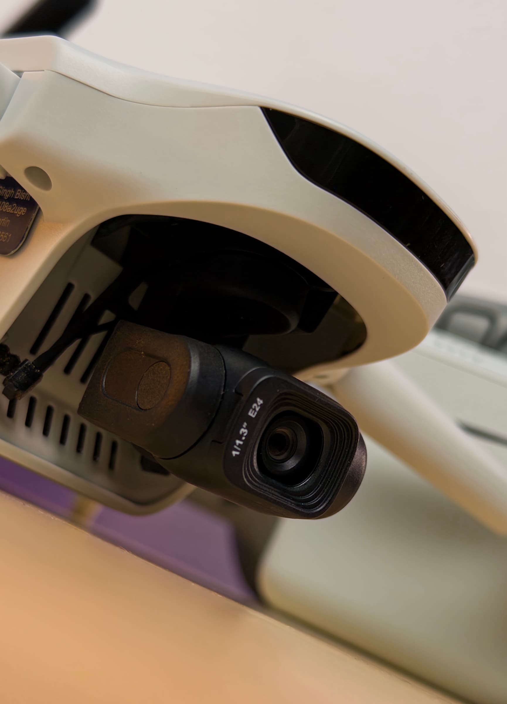 Close-up of the ATOM 3's gimbal camera beneath the front of the drone
